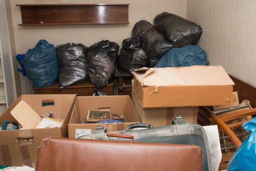 Workers managing and sorting building debris for clearance